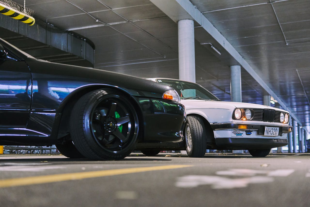 services-01 Two modified cars captured in a stylish parking garage in Auckland, New Zealand.